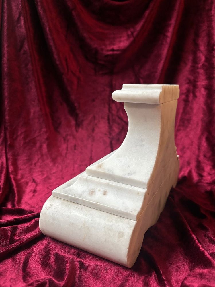 Carved white marble altar base