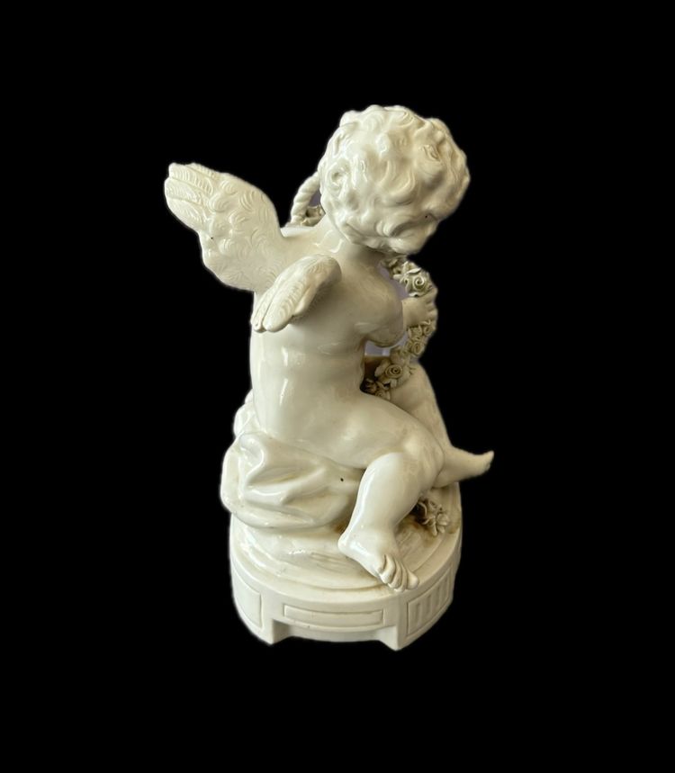 Winged love in Capodimonte porcelain