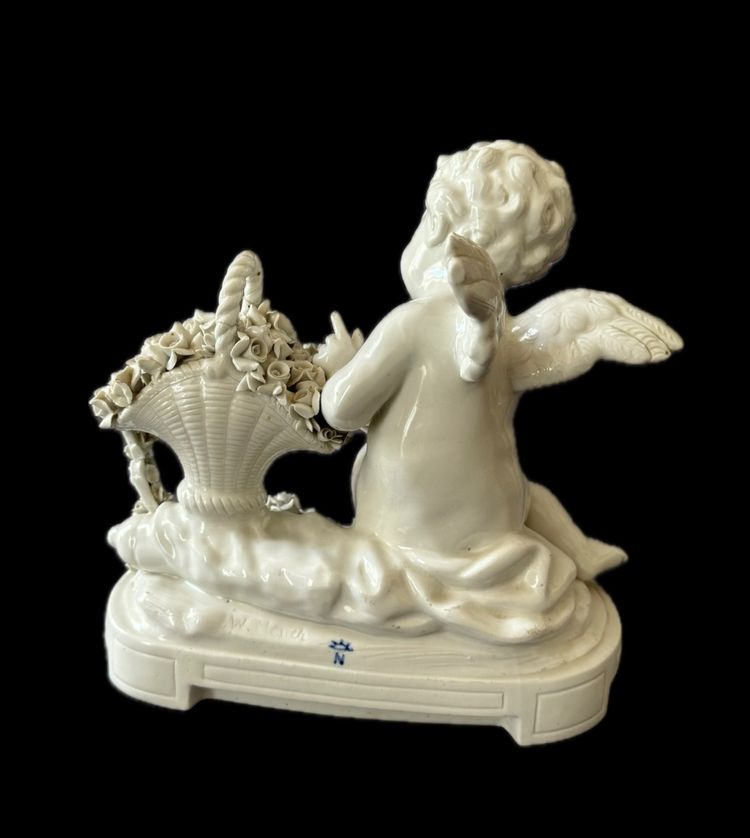 Winged love in Capodimonte porcelain