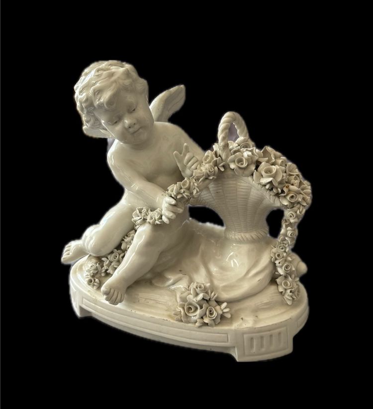 Winged love in Capodimonte porcelain