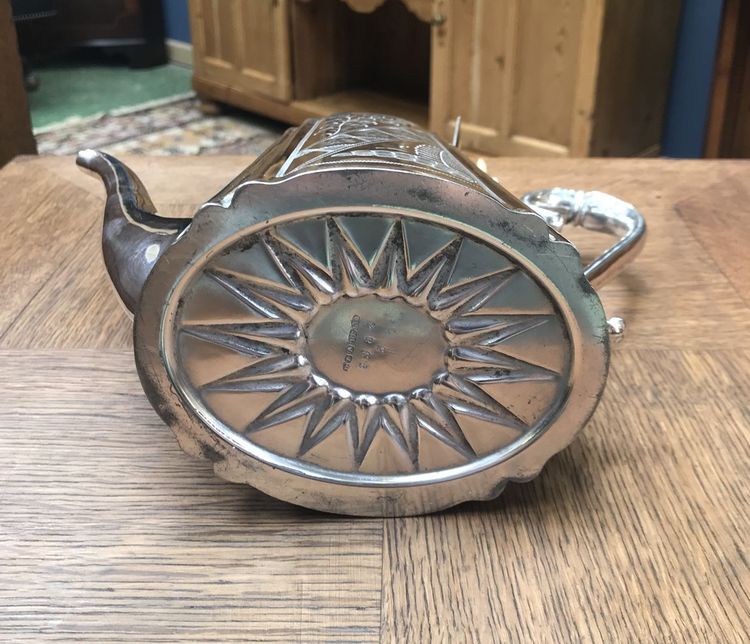 silver-plated metal teapot