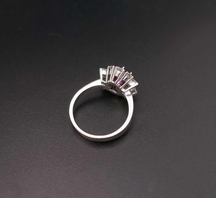 Vintage ring set with a natural intense red ruby (CGL certificate) and diamonds.