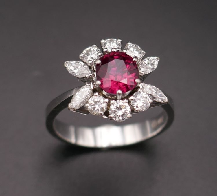Vintage ring set with a natural intense red ruby (CGL certificate) and diamonds.
