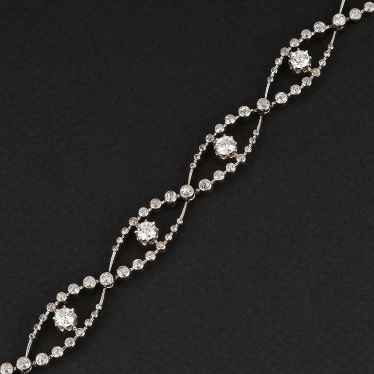 A BELLE ÉPOQUE GOLD, PLATINUM AND DIAMOND BRACELET, CIRCA 1910