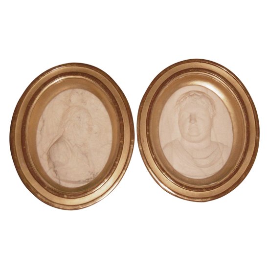 Two marble medallions