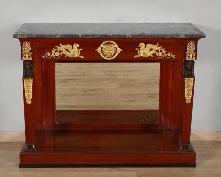 CONSOLE D'ÉPOQUE EMPIRE EN ACAJOU ET BOIS NOIRCI. DÉBUT DU XIXe SIÈCLE