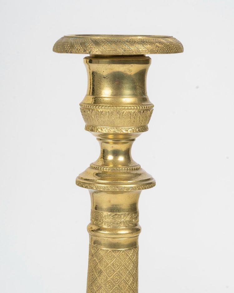 Pair of Louis XVI-style candlesticks in gilded bronze
