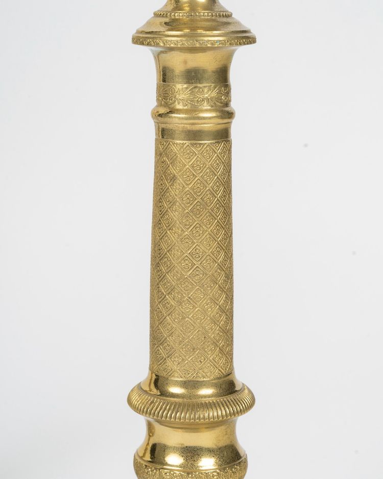 Pair of Louis XVI-style candlesticks in gilded bronze