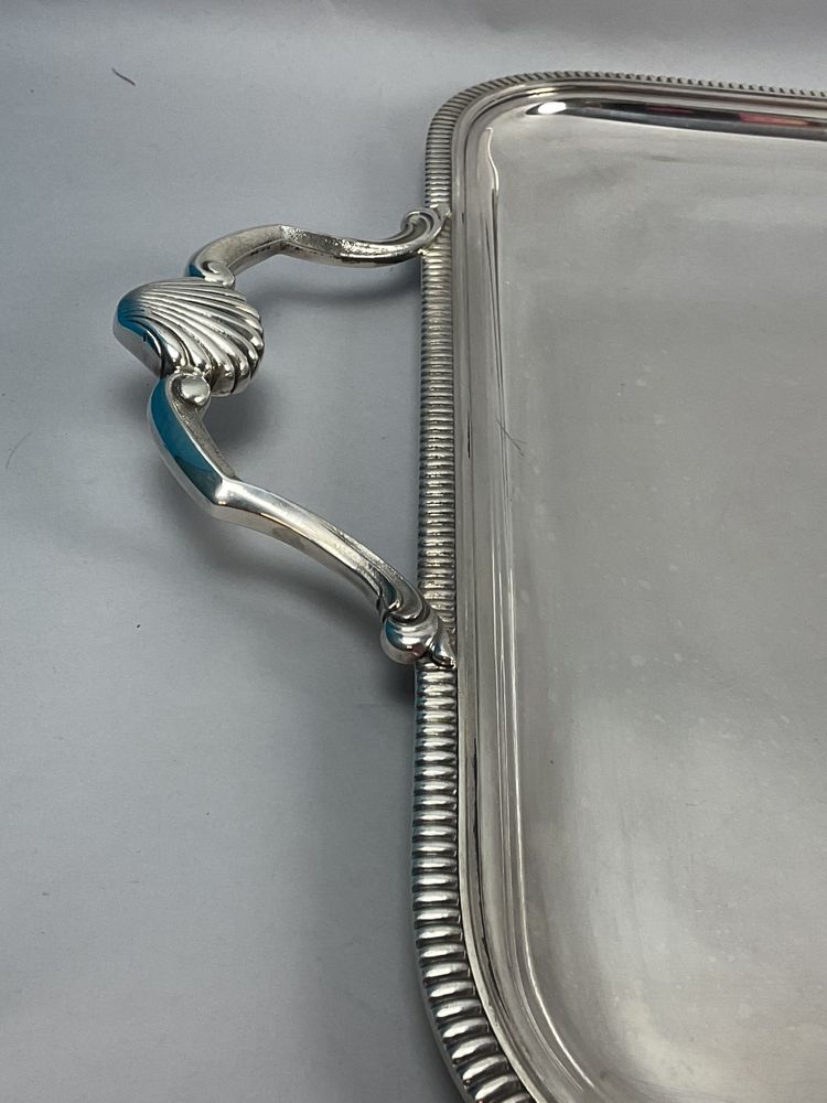 Large silver-plated metal tray with a seashell design 