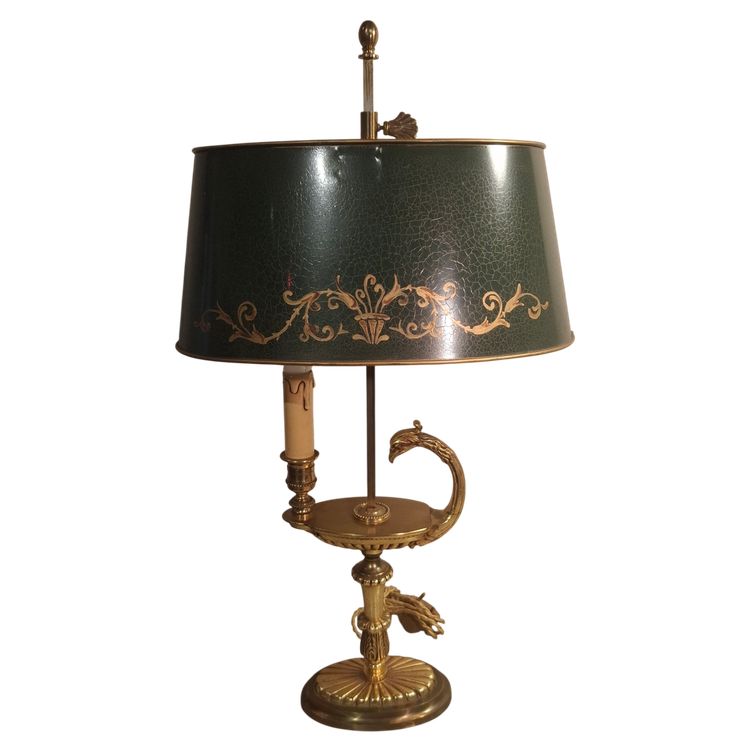 Lampe bouillotte en bronze doré à tête de griffon, époque XXème siècle.