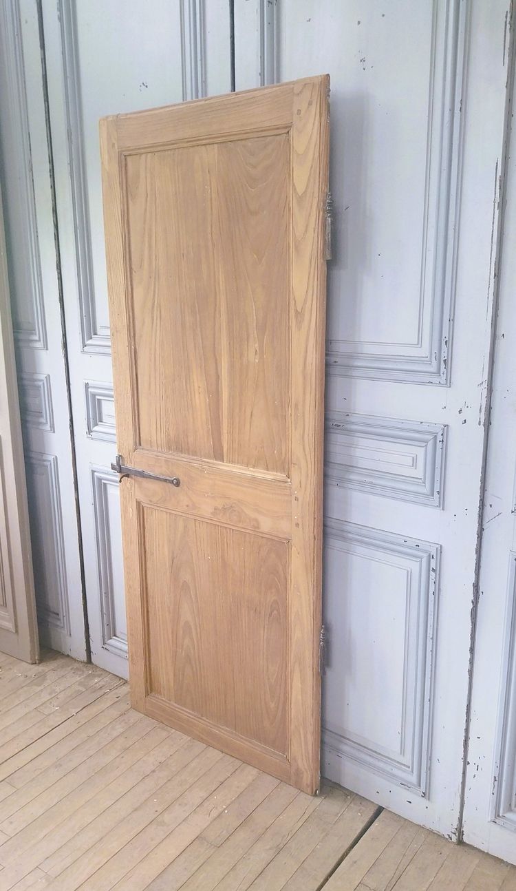 Small 18th-century wood-framed door in light oak