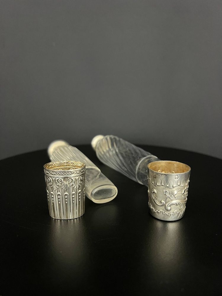 Two travel bottles known as "Eau de Mélisse" in cut crystal and solid silver Minerva