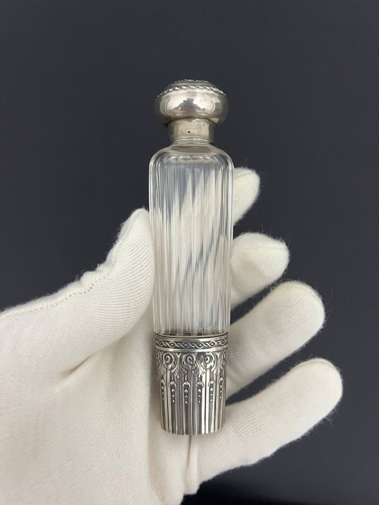 Two travel bottles known as "Eau de Mélisse" in cut crystal and solid silver Minerva