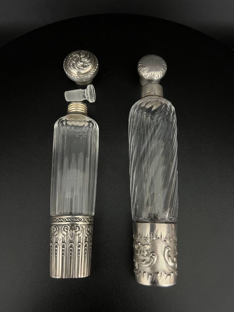 Two travel bottles known as "Eau de Mélisse" in cut crystal and solid silver Minerva