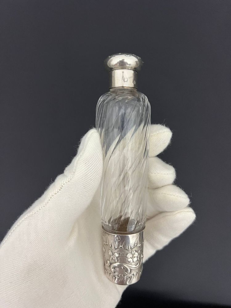 Two travel bottles known as "Eau de Mélisse" in cut crystal and solid silver Minerva