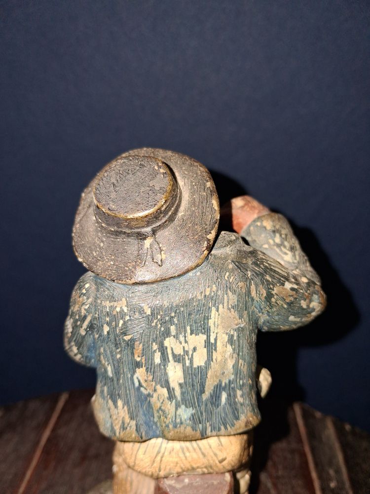 Polychrome cast iron statue of a popular figure