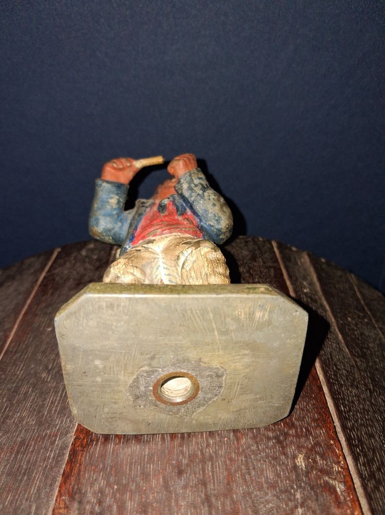 Polychrome cast iron statue of a popular figure