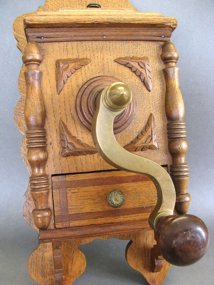 Large wall-mounted coffee grinder from a 19th-century pub.