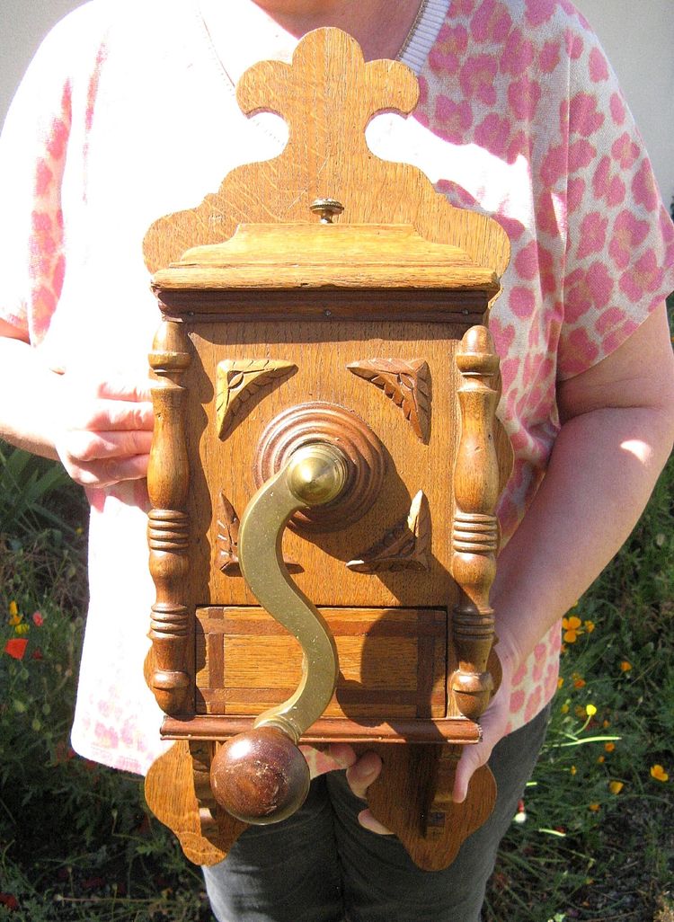 Large wall-mounted coffee grinder from a 19th-century pub.