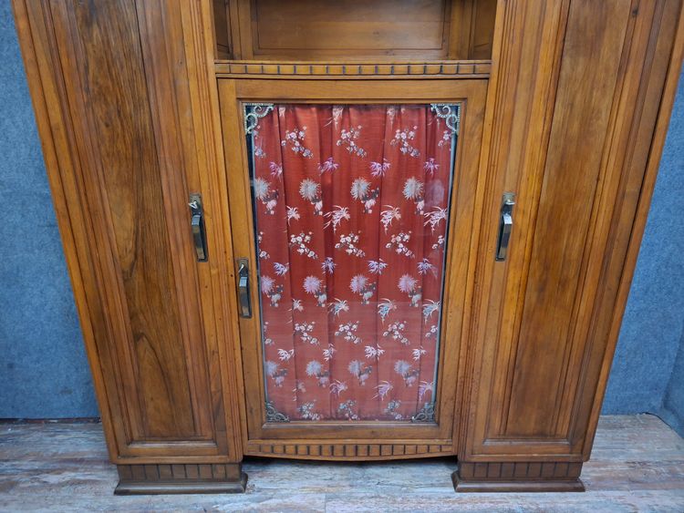 Art Deco bookcase in carved walnut, circa 1930