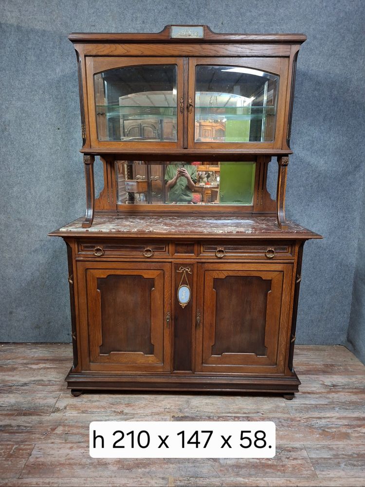 Two-part Louis XVI style oak buffet with an English porcelain plaque.
