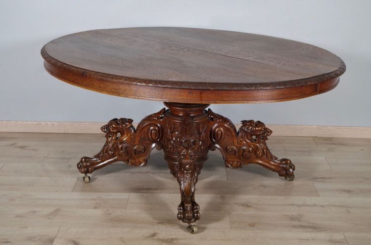 Large Renaissance-style carved oak pedestal table, circa 1900
