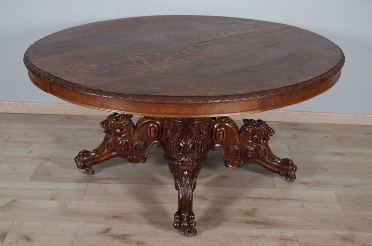 Large Renaissance-style carved oak pedestal table, circa 1900
