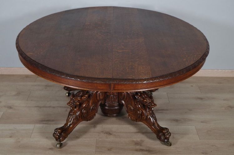 Large Renaissance-style carved oak pedestal table, circa 1900