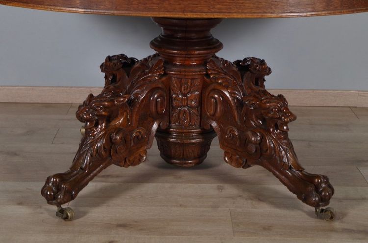Large Renaissance-style carved oak pedestal table, circa 1900
