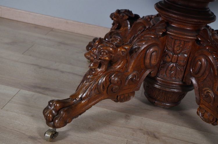 Large Renaissance-style carved oak pedestal table, circa 1900