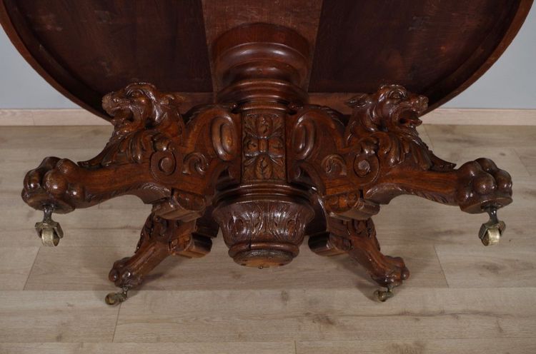 Large Renaissance-style carved oak pedestal table, circa 1900