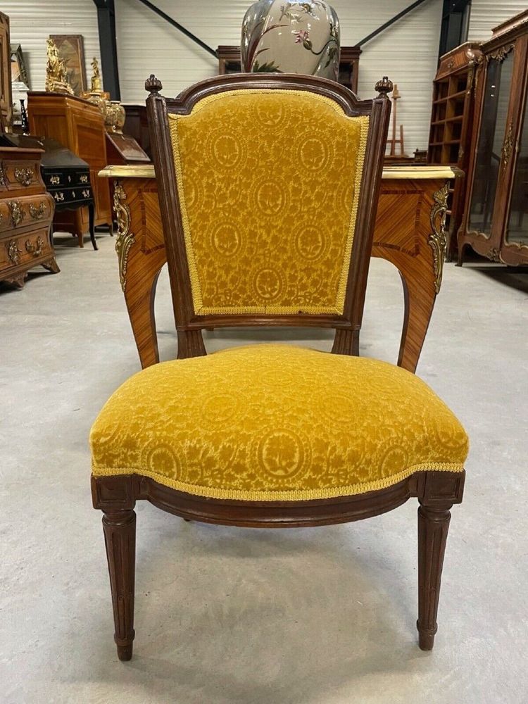 Three Louis XVI-style chairs in molded and carved walnut, 18th century