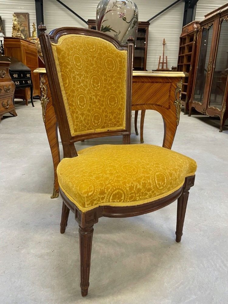 Three Louis XVI-style chairs in molded and carved walnut, 18th century