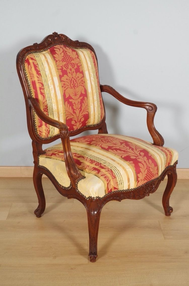 Pair of Regency armchairs in carved walnut with flat backs, circa 1900