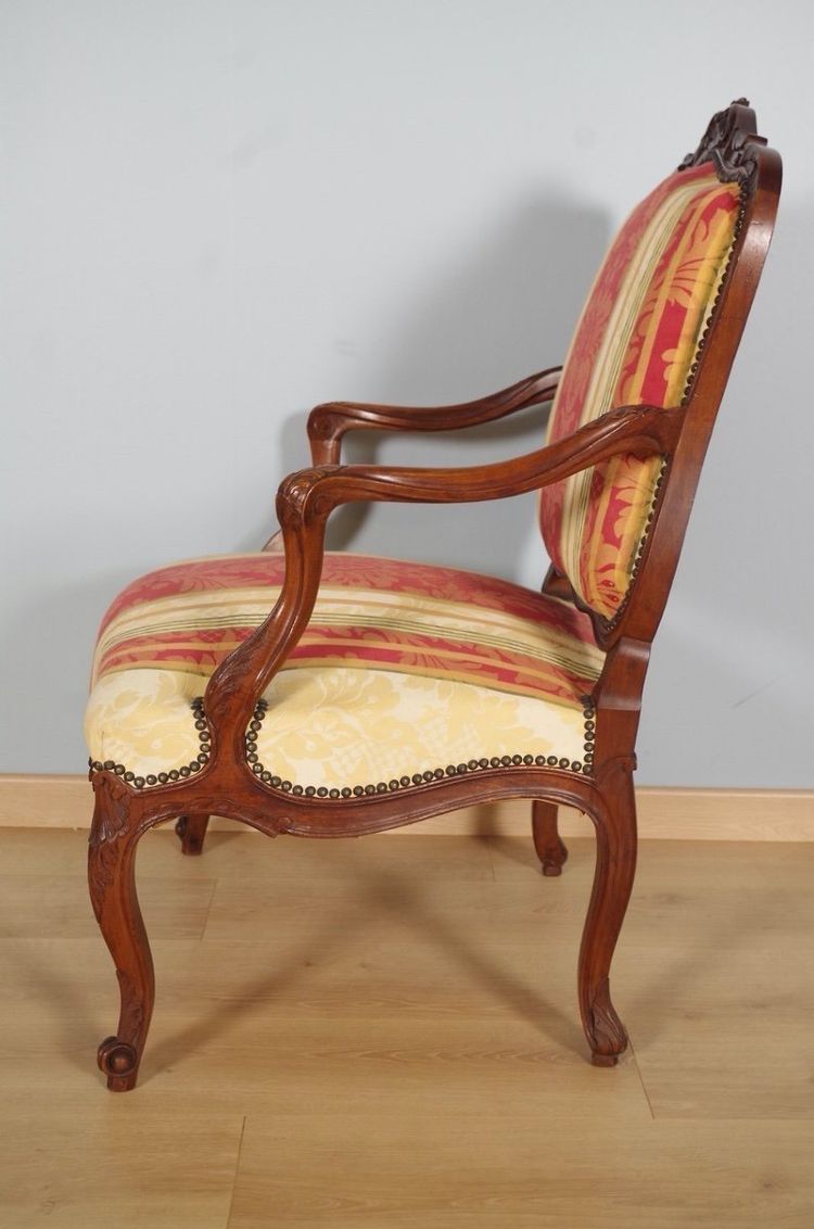 Pair of Regency armchairs in carved walnut with flat backs, circa 1900