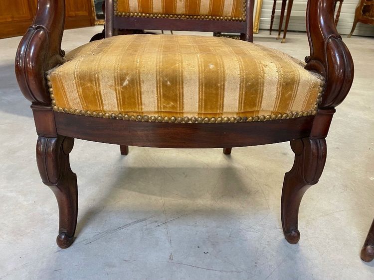 Pair of Restoration-style mahogany armchairs with curved backs, circa 1815
