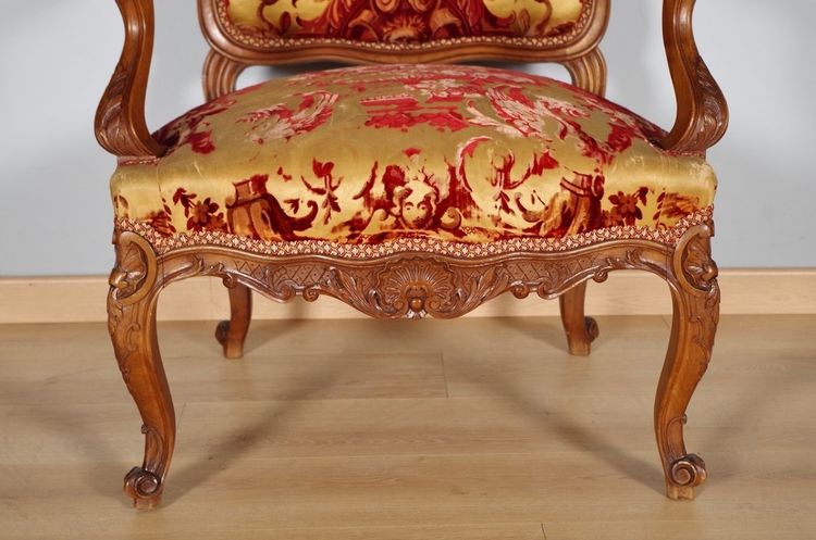 Pair of large Regency armchairs in carved walnut, circa 1900