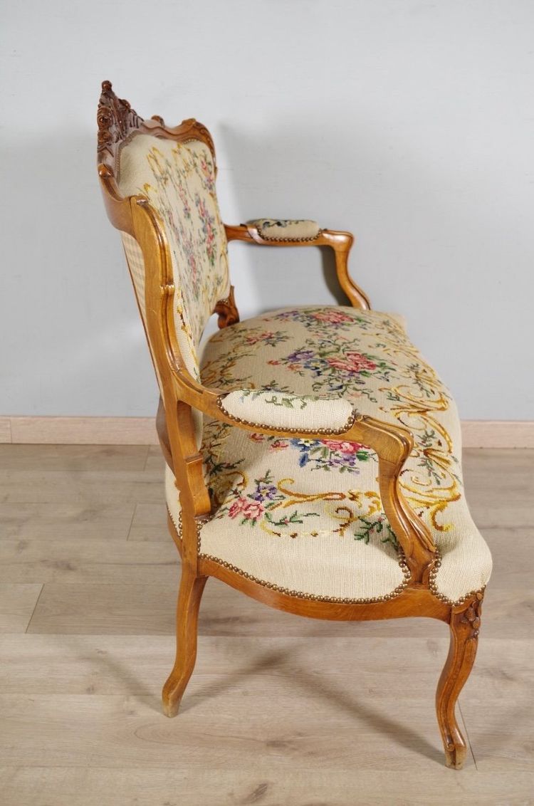 Louis XV style sofa in carved walnut and petit point tapestry, circa 1900