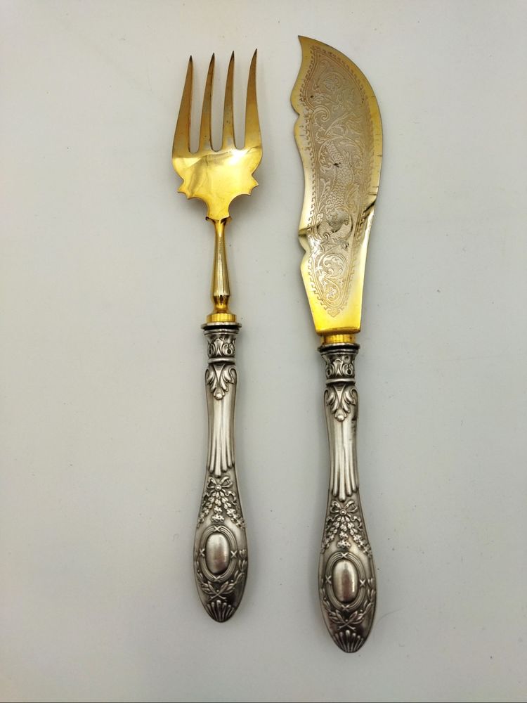 Silver-plated and filled fish cutlery in the Louis XV style. Tableware.