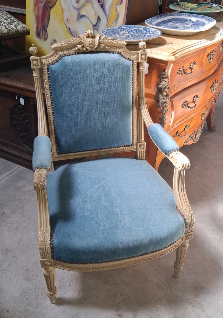 Louis XVI style armchair in lacquered wood, upholstered in blue velvet