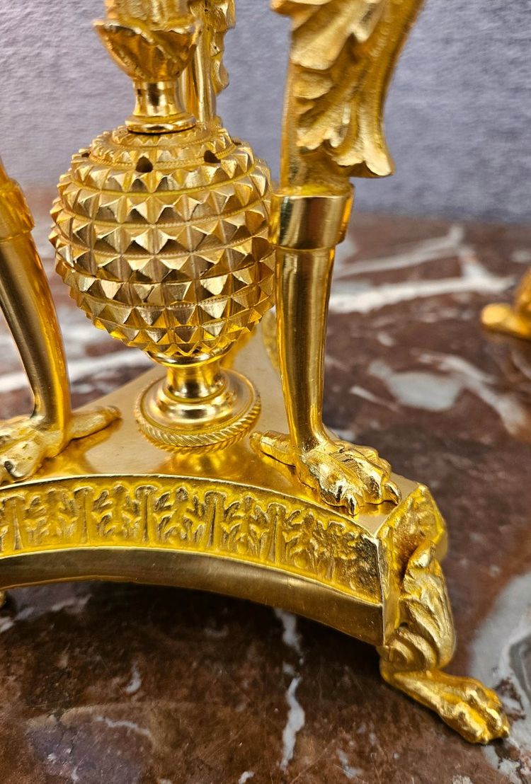 Pair of bronze candlesticks with eagles and tassels