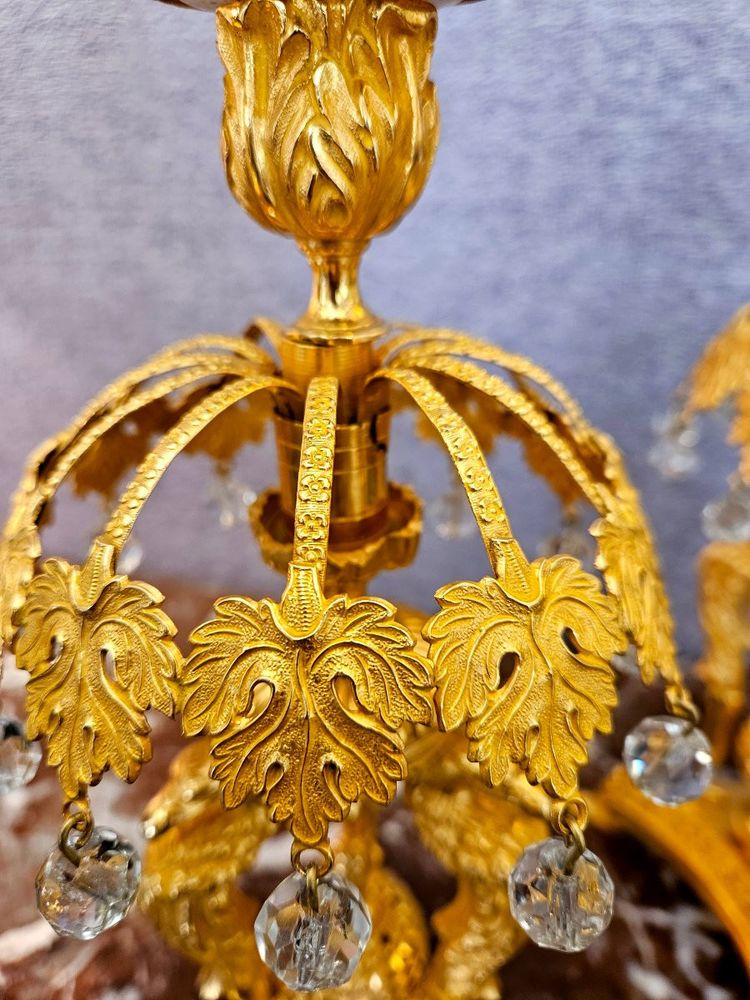 Pair of bronze candlesticks with eagles and tassels