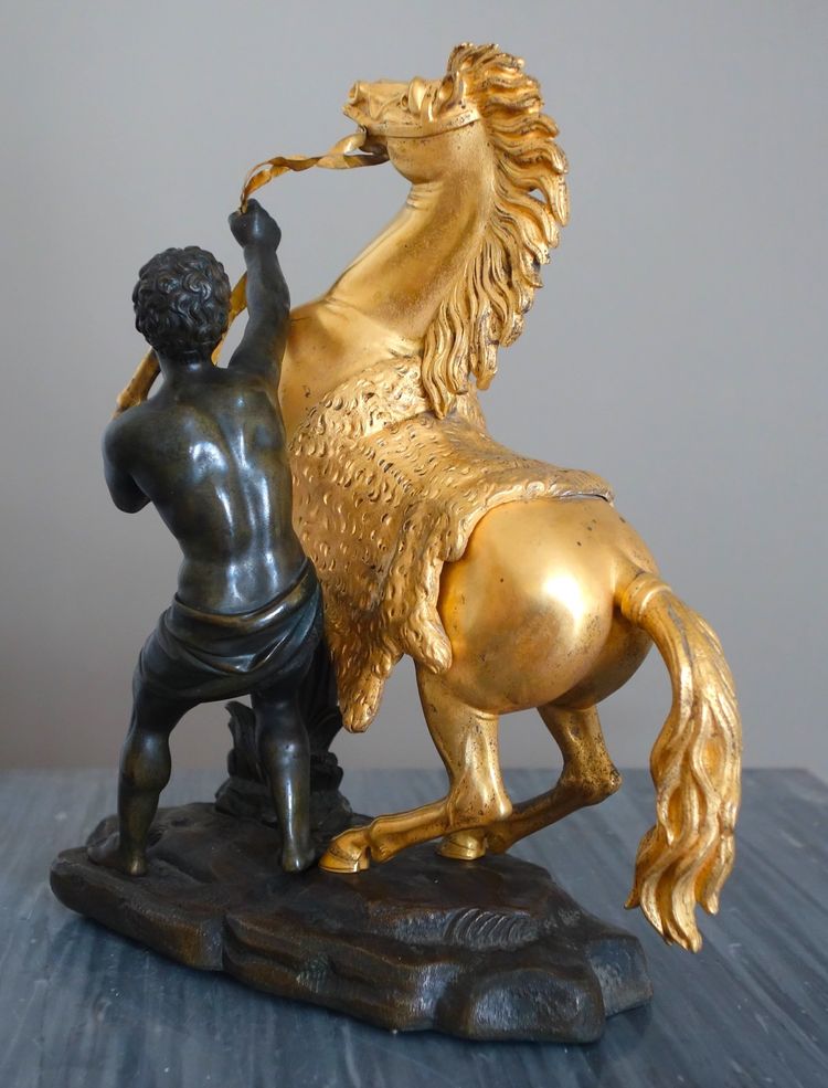 Cheval de Marly groupe en bronze patiné et doré au mercure d'époque Restauration début XIXe siècle