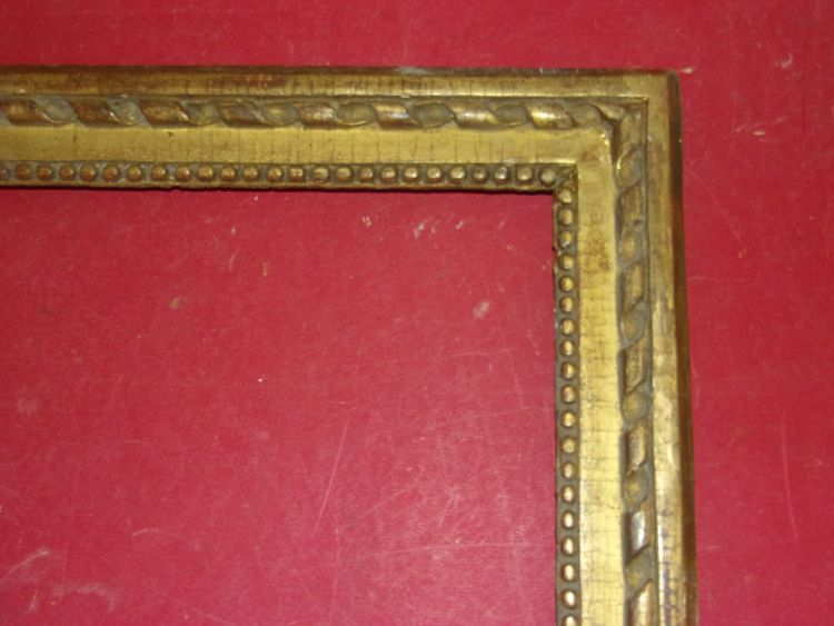 18th-century Louis XVI giltwood frame.