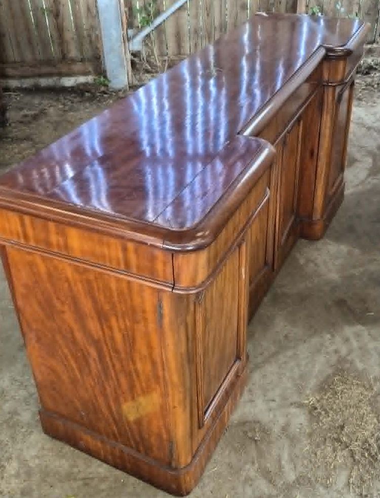 Large mahogany sideboard with attached cabinets—19th century