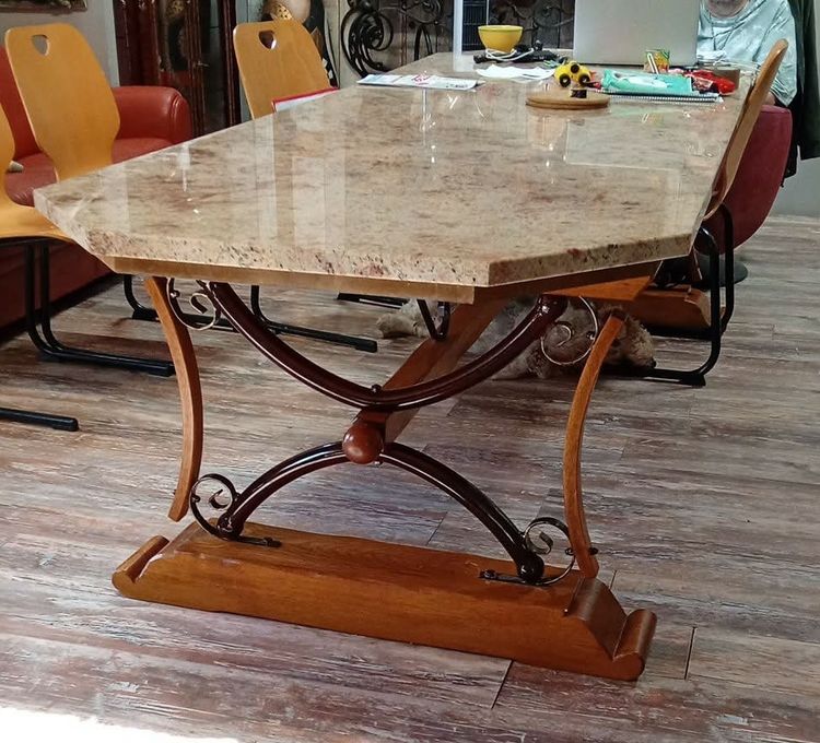 Large dining table made of polished granite with an oak and wrought-iron base 