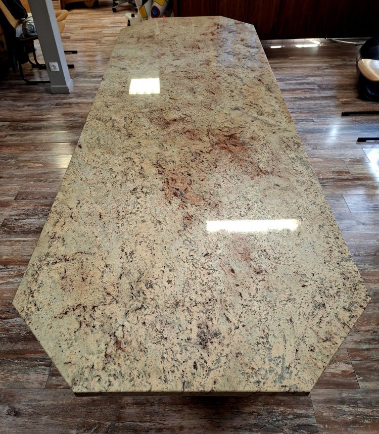 Large dining table made of polished granite with an oak and wrought-iron base 