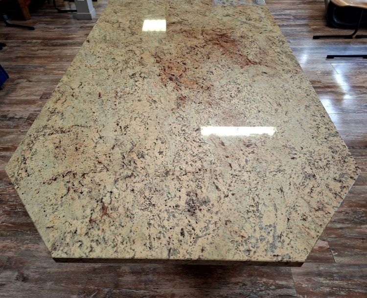 Large dining table made of polished granite with an oak and wrought-iron base 