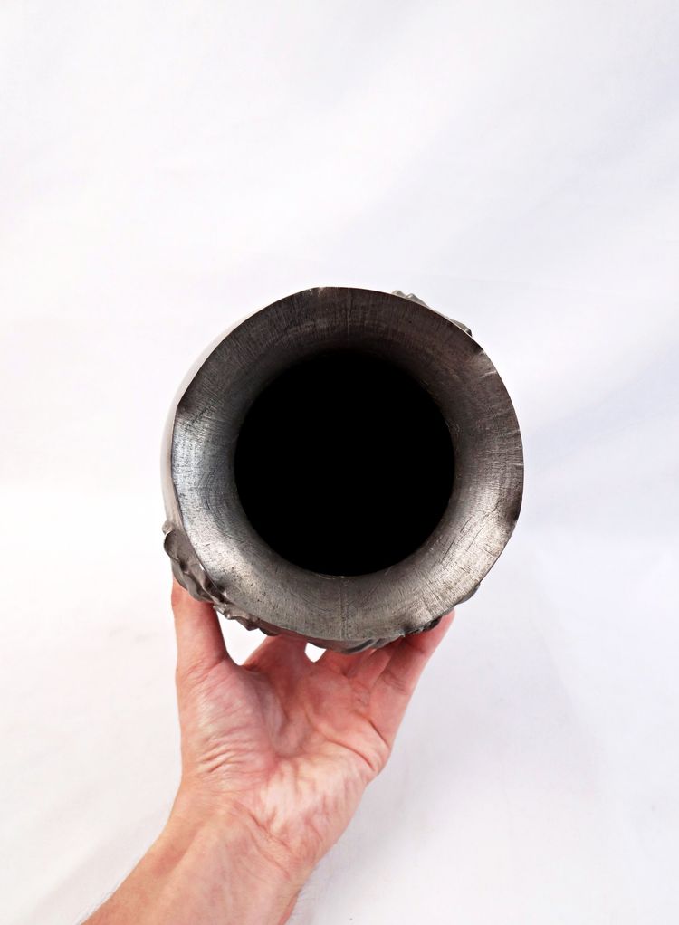 Art Nouveau vase with bas-relief flowers, signed Rispal, in pewter, early 20th century