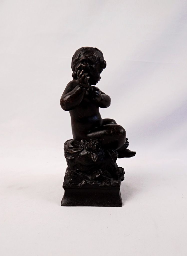 "The Child and the Lizard," a statuette in regul, with a brown patina, signed by Hyppolite Moreau, 19th century